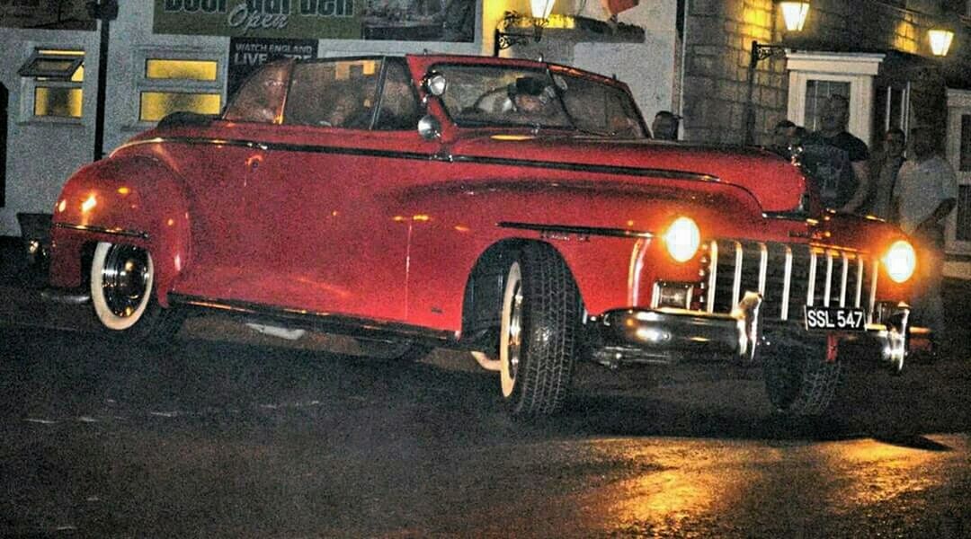 CARS PARKED ON STREET AT NIGHT