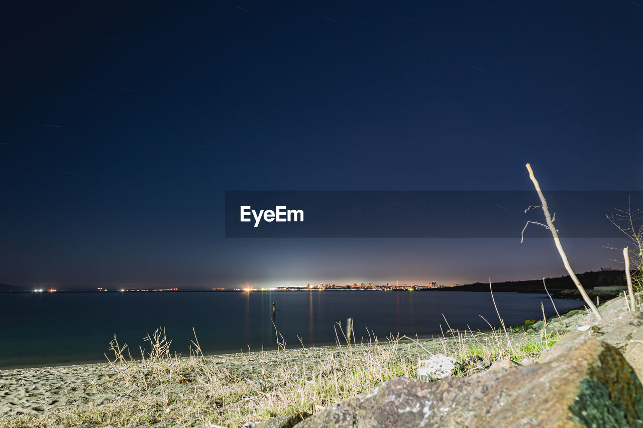 SCENIC VIEW OF LAND AGAINST SKY AT NIGHT