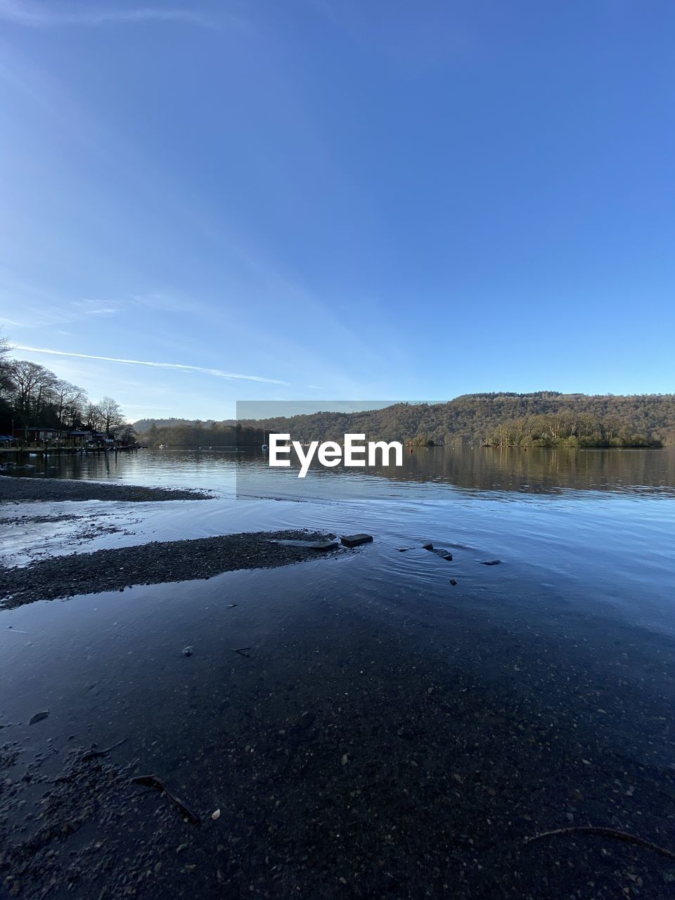 VIEW OF LAKE AGAINST BLUE SKY