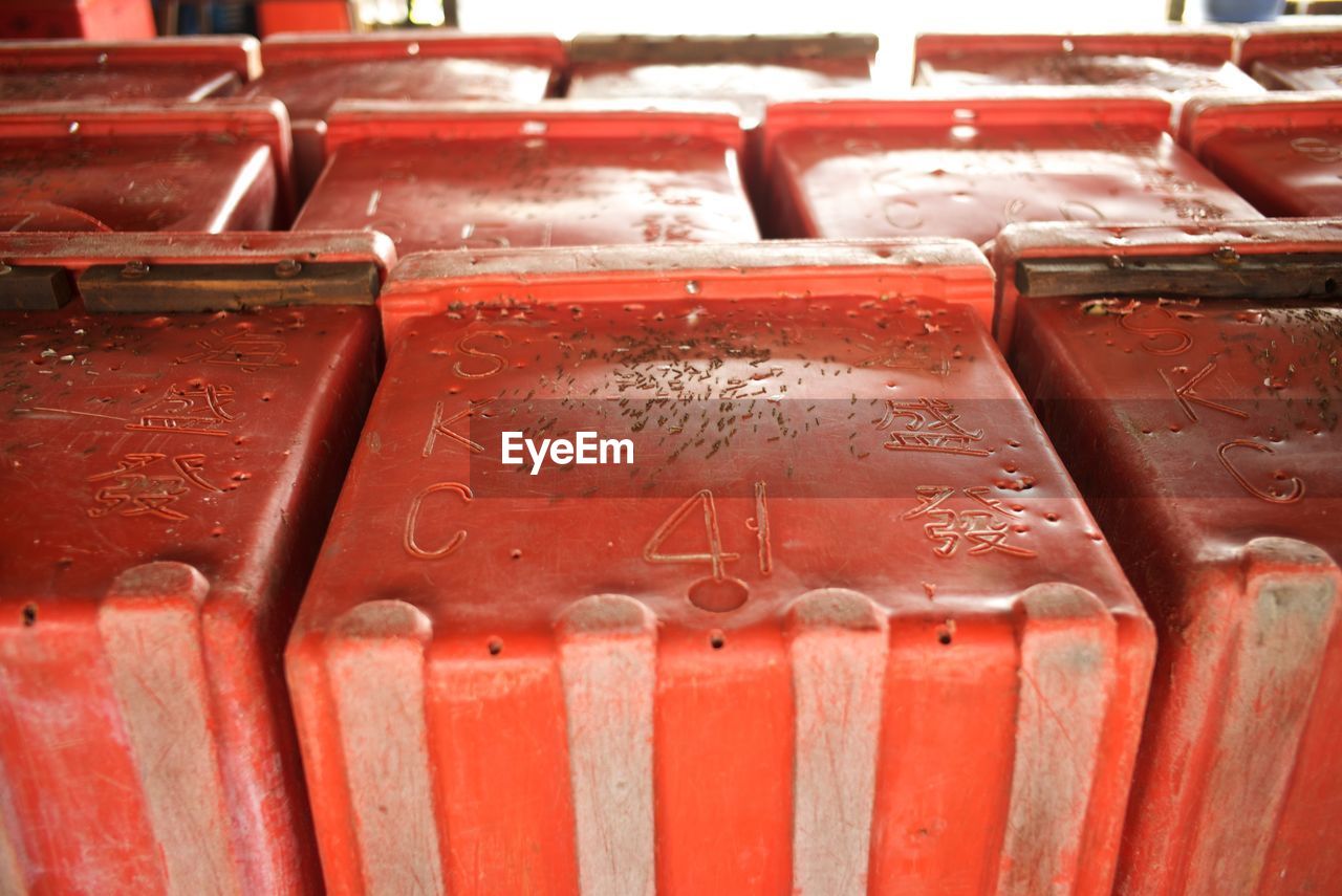 Red containers arranged side by side