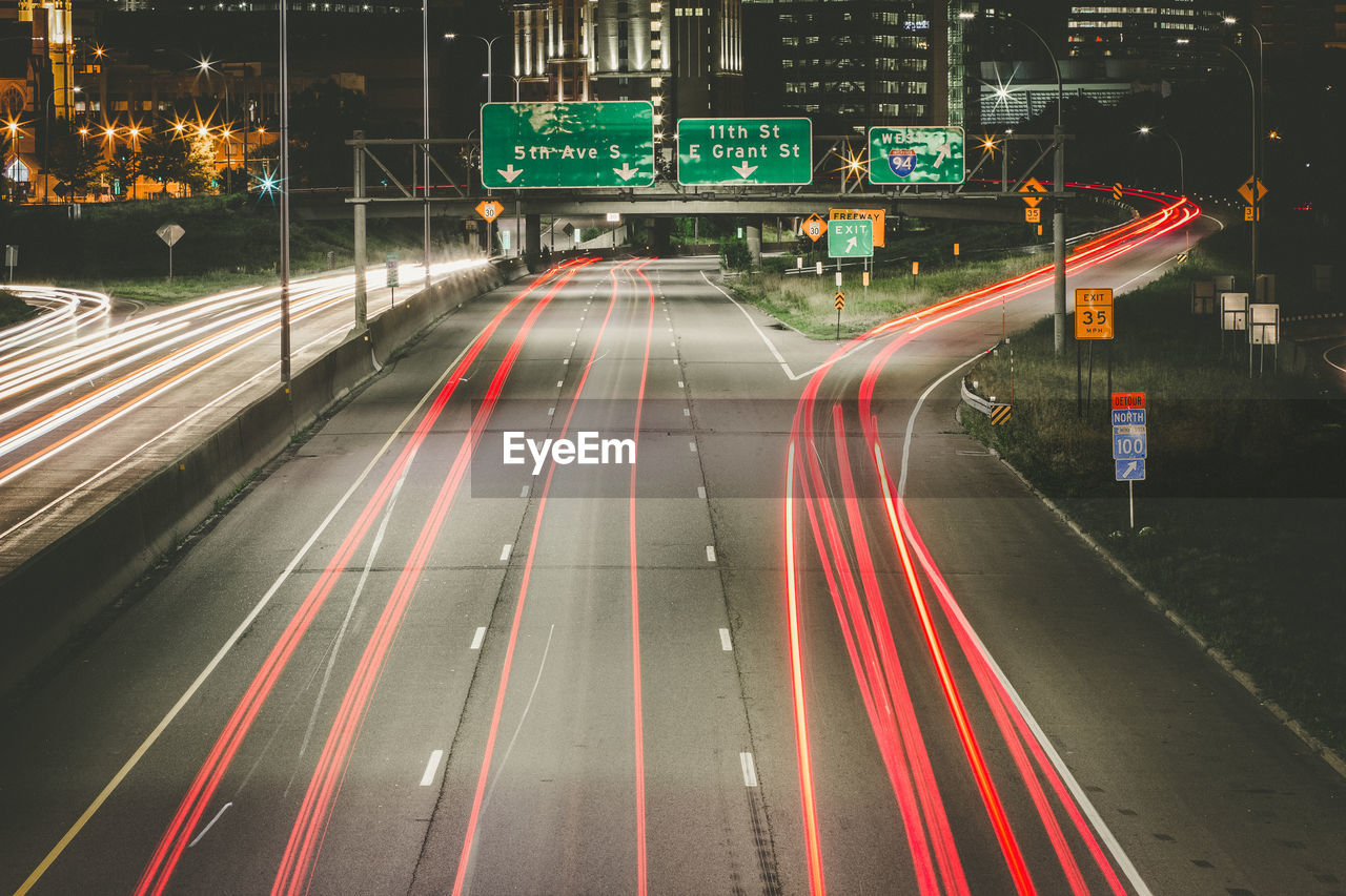 High angle view of light trails on road at night