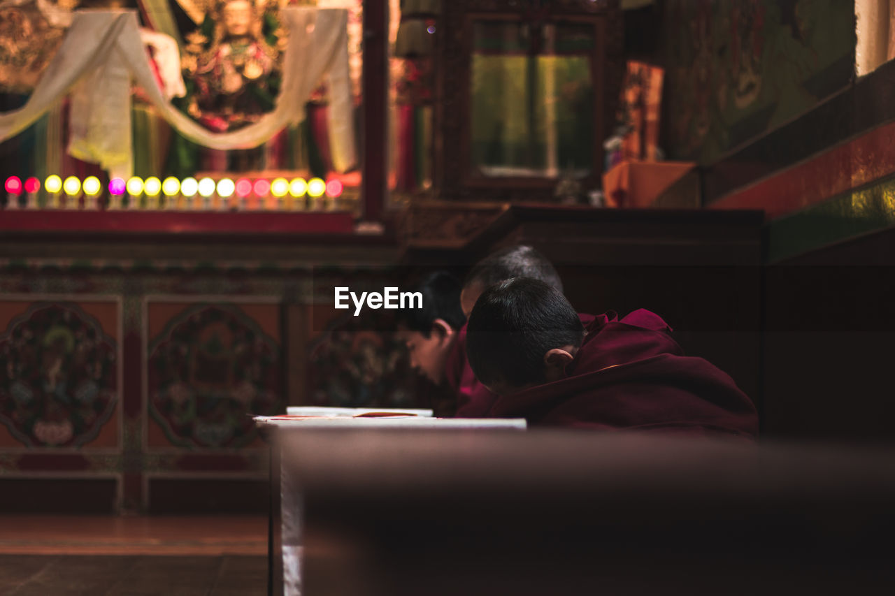 Monks praying in temple