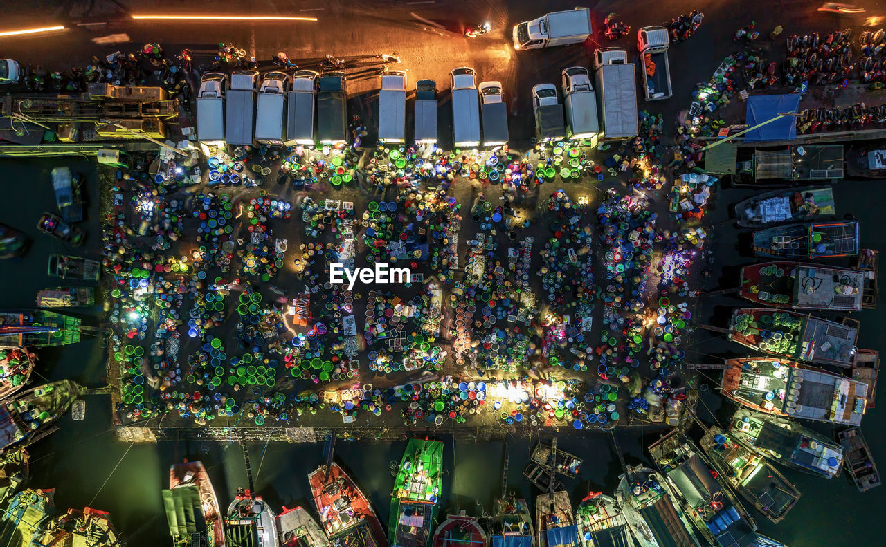 Aerial view of illuminated floating market at night