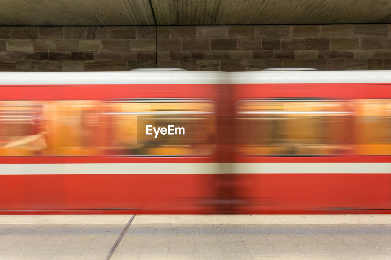 BLURRED MOTION OF TRAIN AT STATION