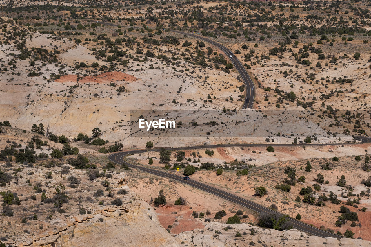 High angle view of winding road passing through a desert