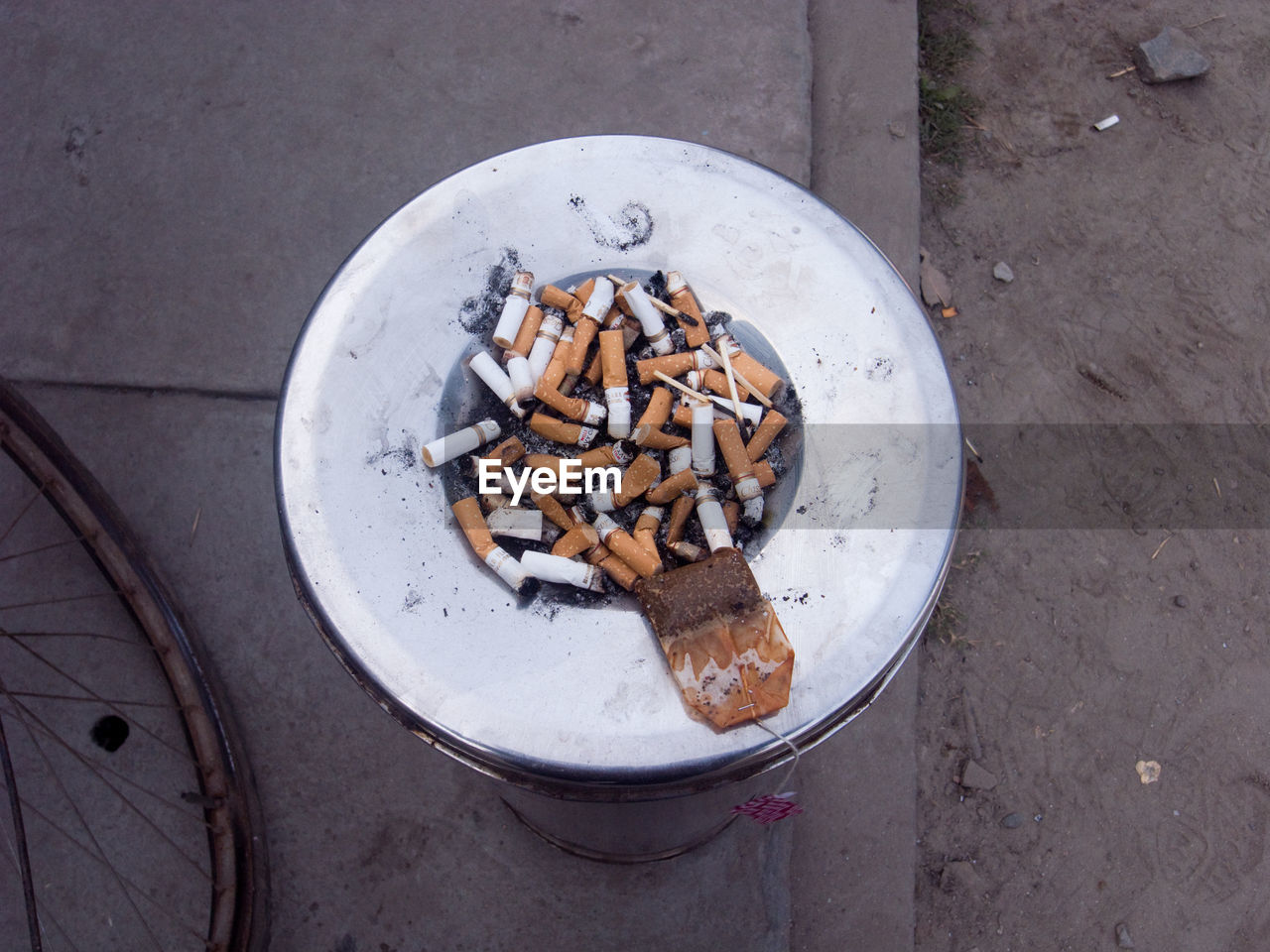 Directly above shot of cigarette butts in ashtray