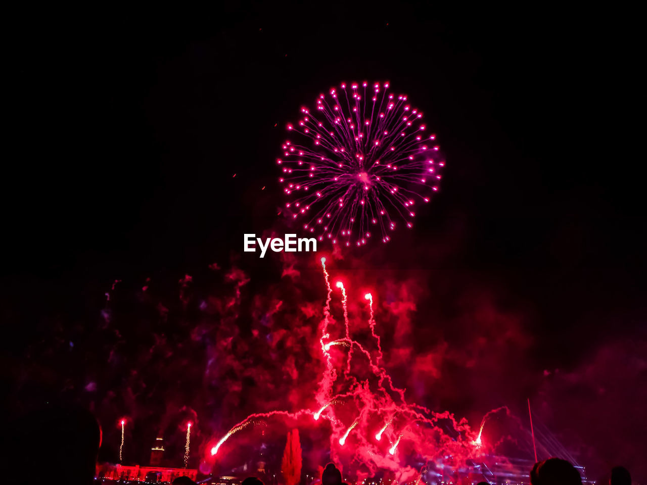 LOW ANGLE VIEW OF FIREWORK DISPLAY