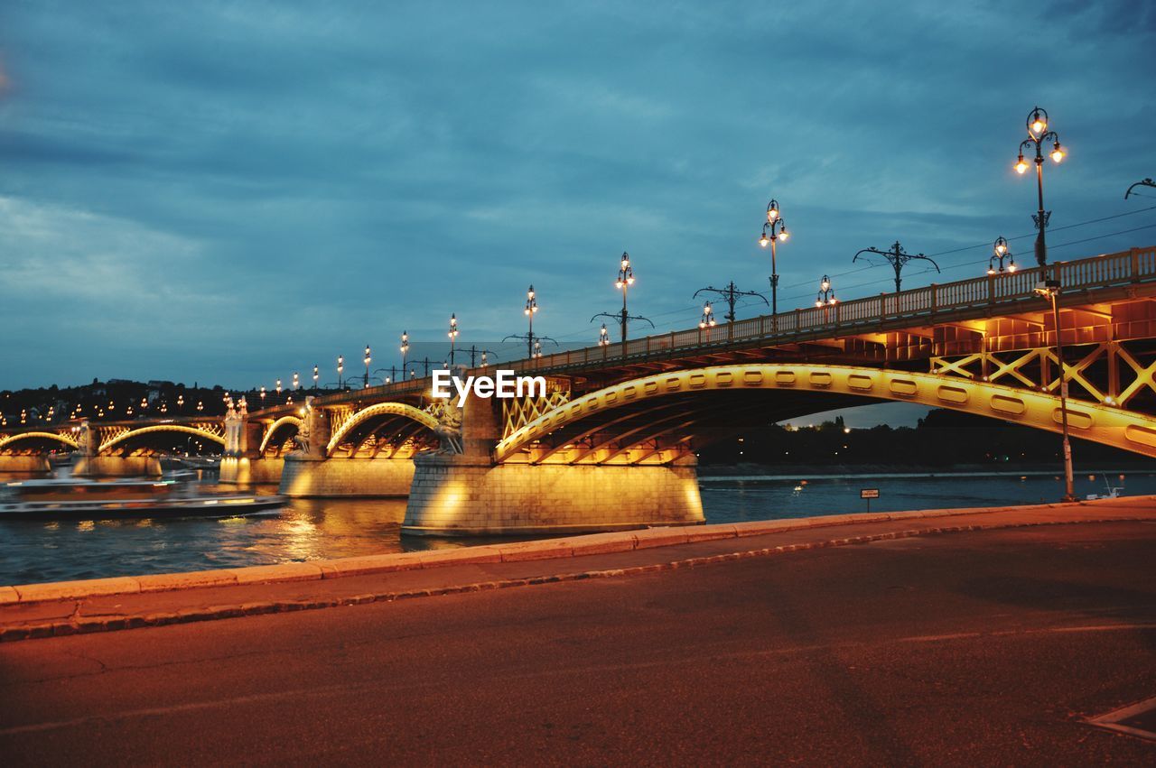 Margaret bridge over river against sky in city