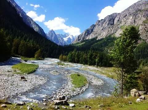 SCENIC VIEW OF RIVER AND MOUNTAINS