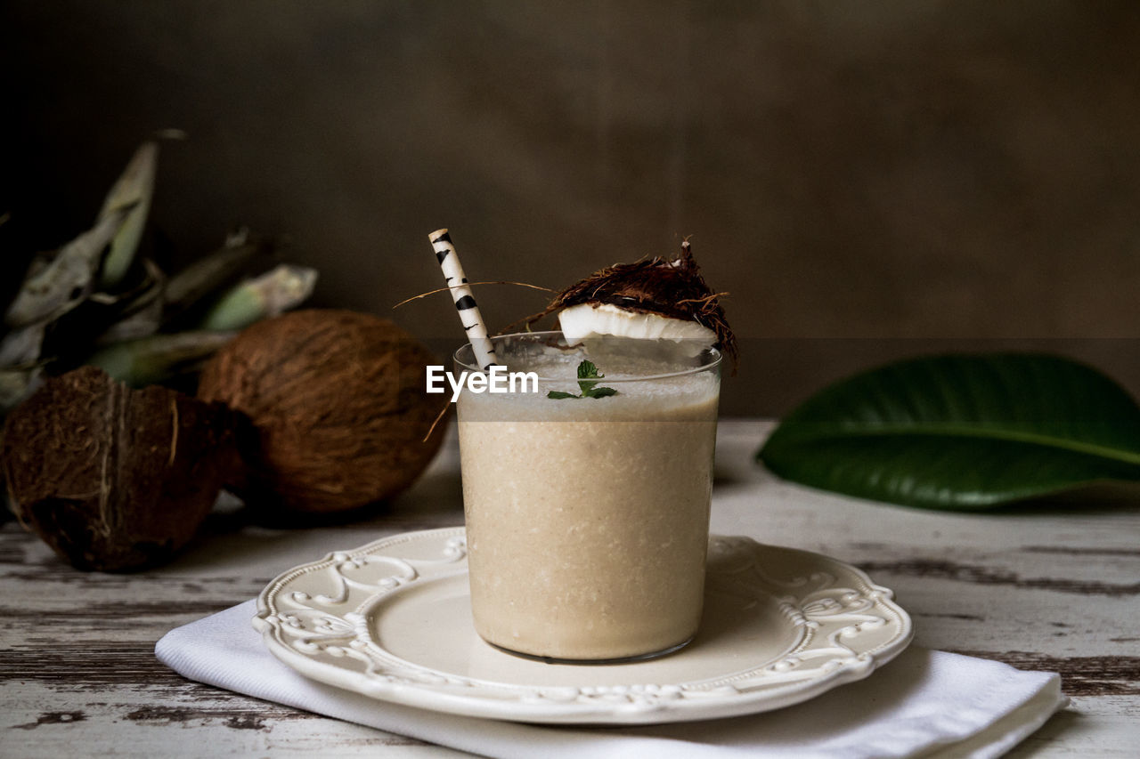 CLOSE-UP OF DRINK SERVED ON TABLE IN PLATE