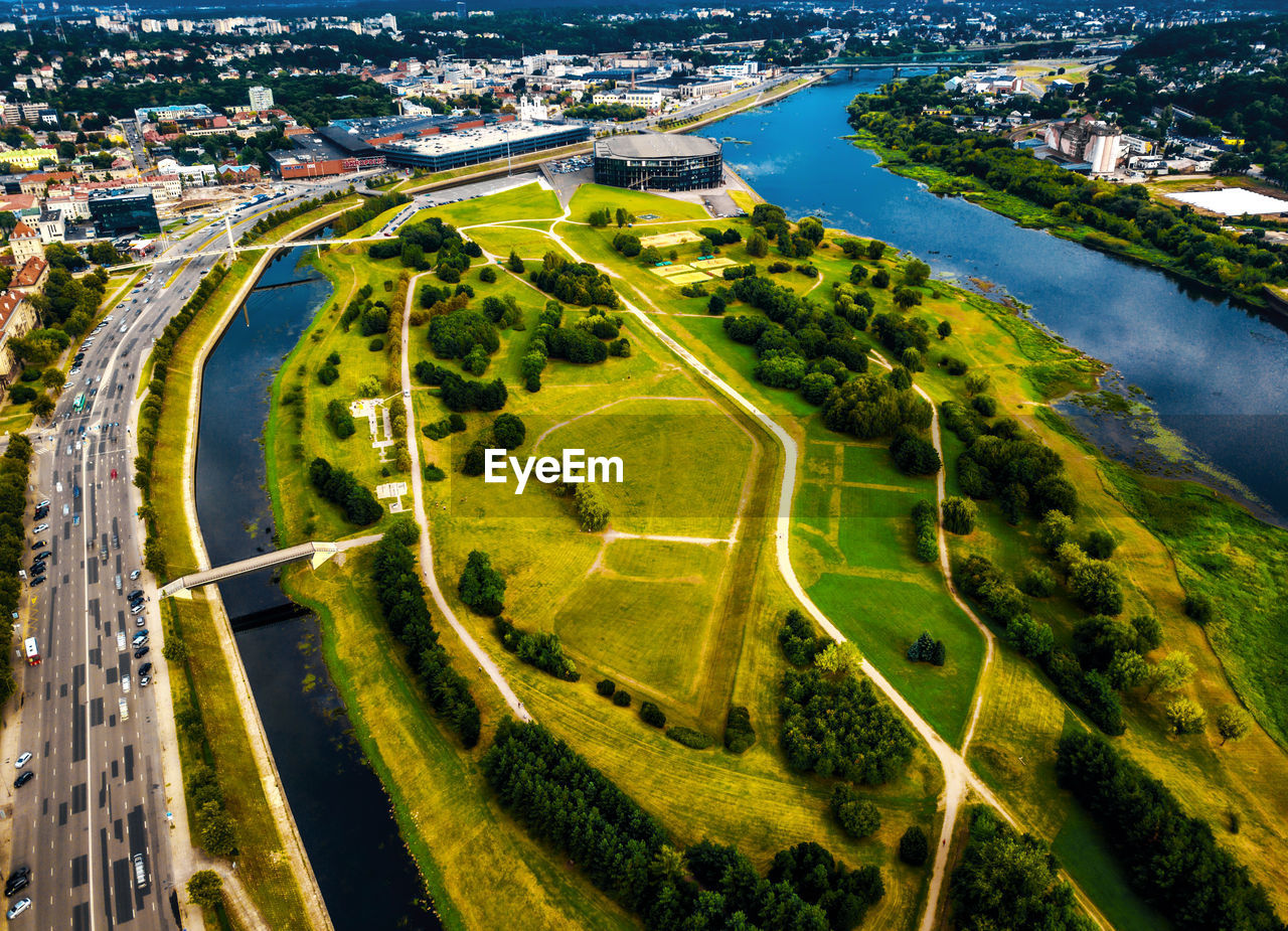 Aerial view of landscape and river amidst city