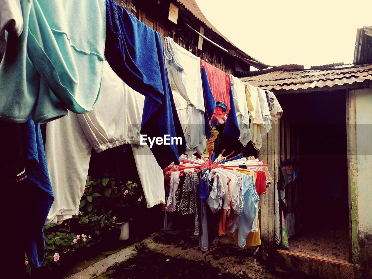 Clothes drying against buildings at market