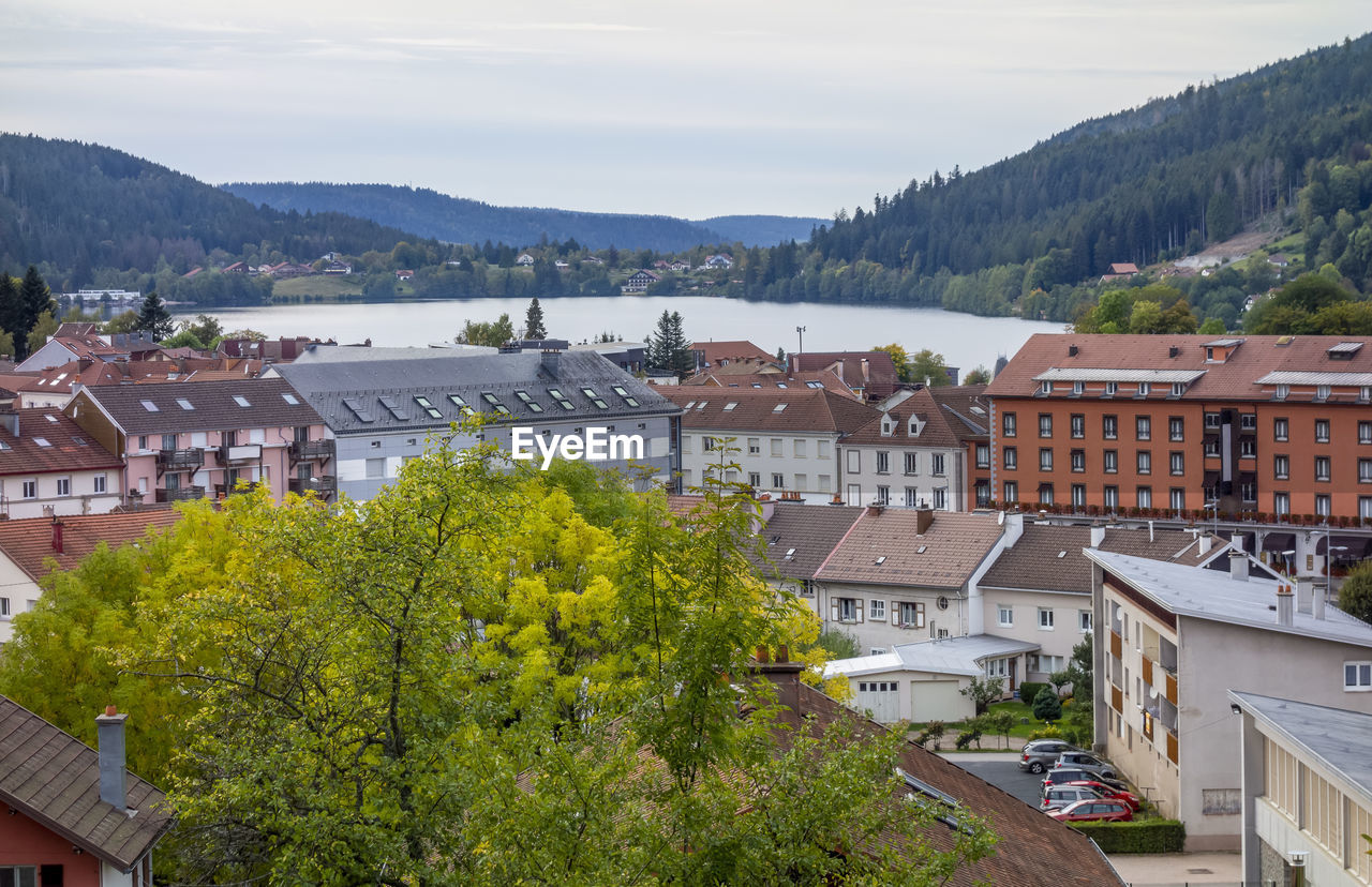 HIGH ANGLE VIEW OF TOWNSCAPE BY BUILDINGS