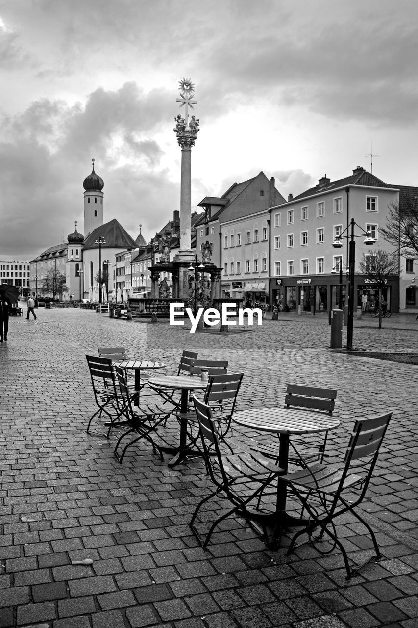 PEOPLE ON STREET BY BUILDINGS IN TOWN