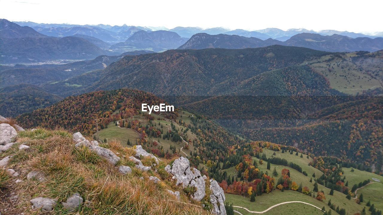 HIGH ANGLE VIEW OF TREES AND MOUNTAINS AGAINST SKY