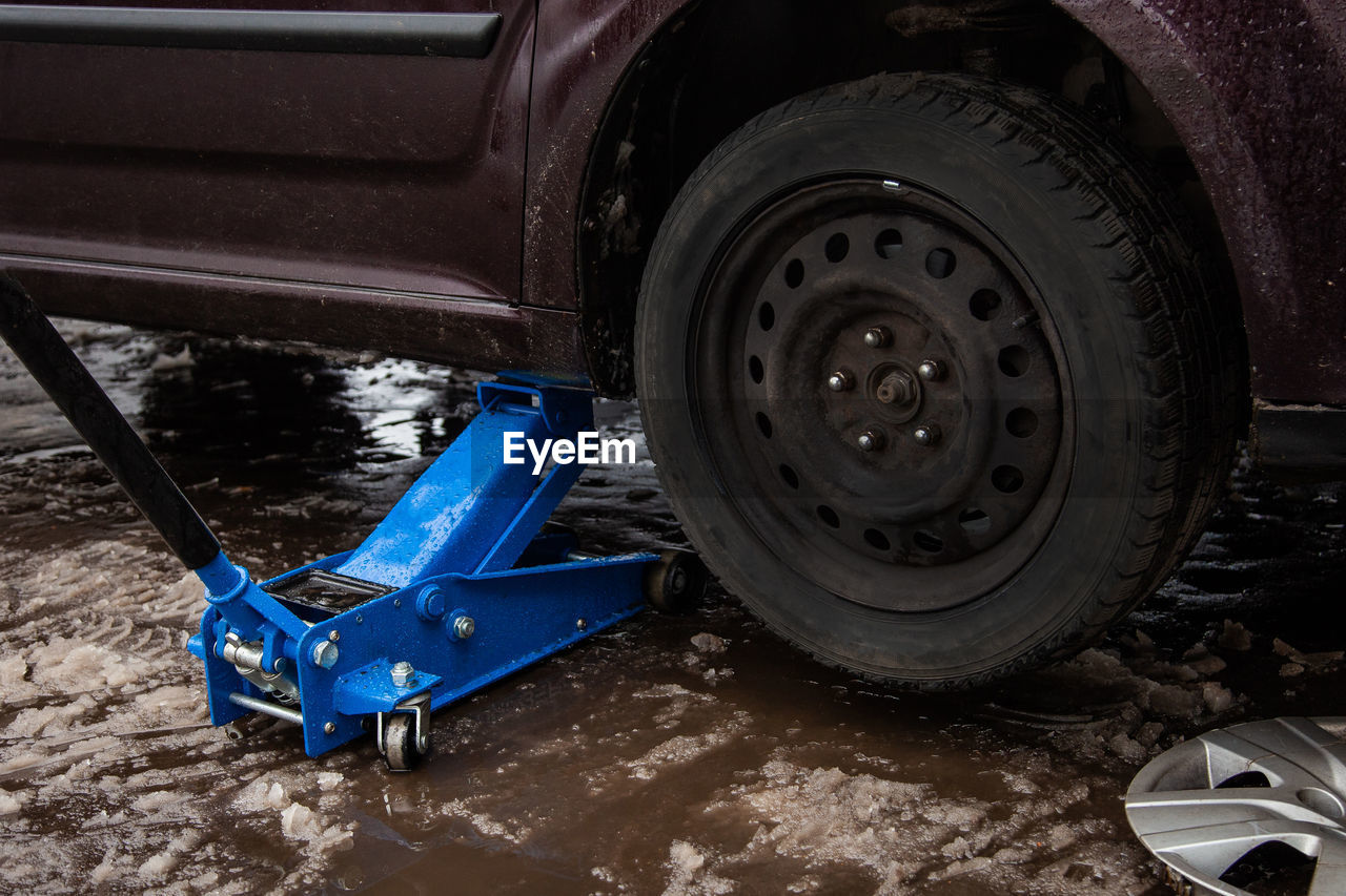 Car jack up for lifting wheels, auto repair.