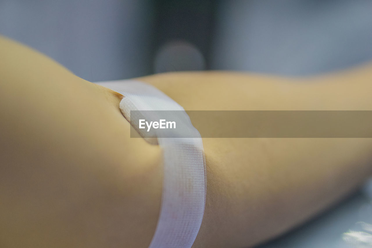 Cropped image of person hand with bandage