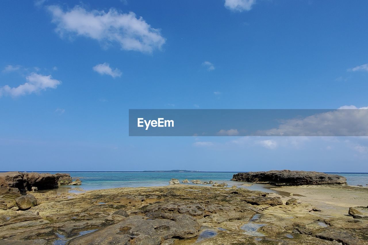 Scenic view of beach against sky