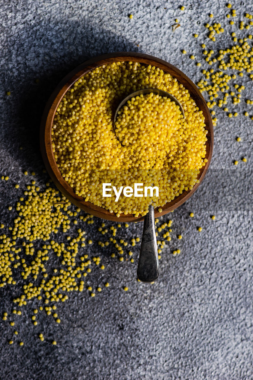 High angle view of mustard seeds in container