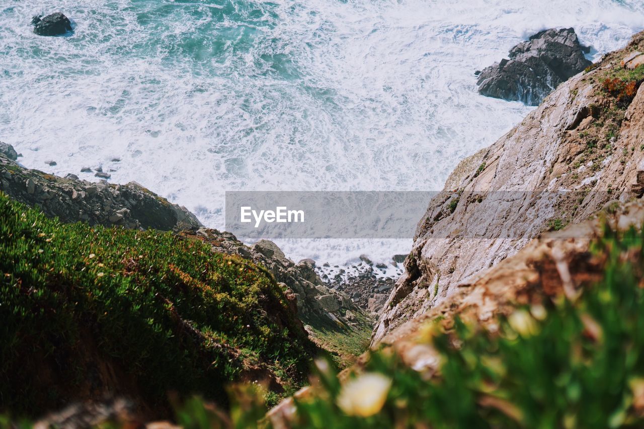 SCENIC VIEW OF ROCKS ON SHORE