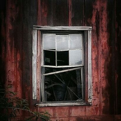 CLOSED WINDOW OF OLD HOUSE