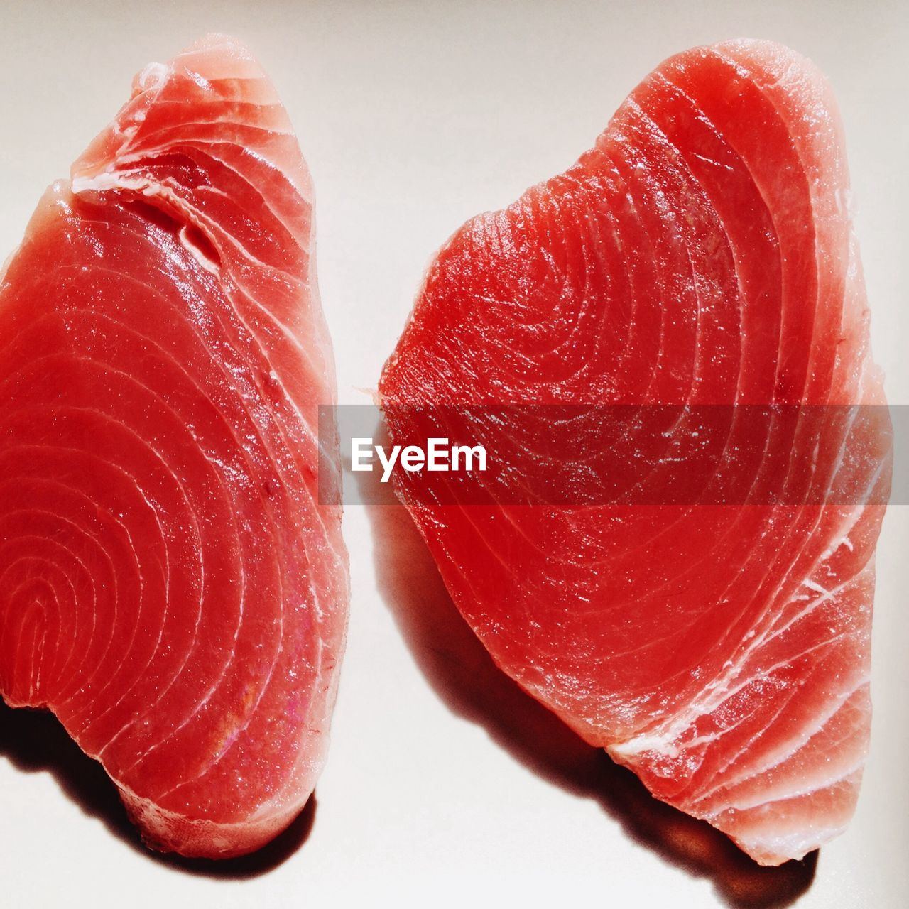 Close-up of red meat against white background