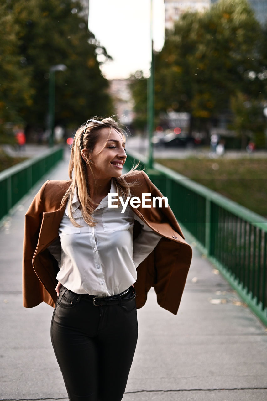 Beautiful woman standing in city