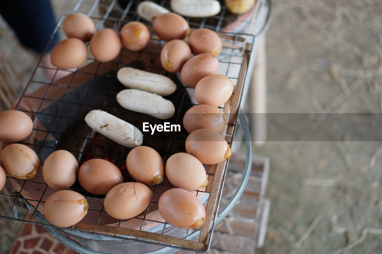High angle view of eggs on barbecue grill