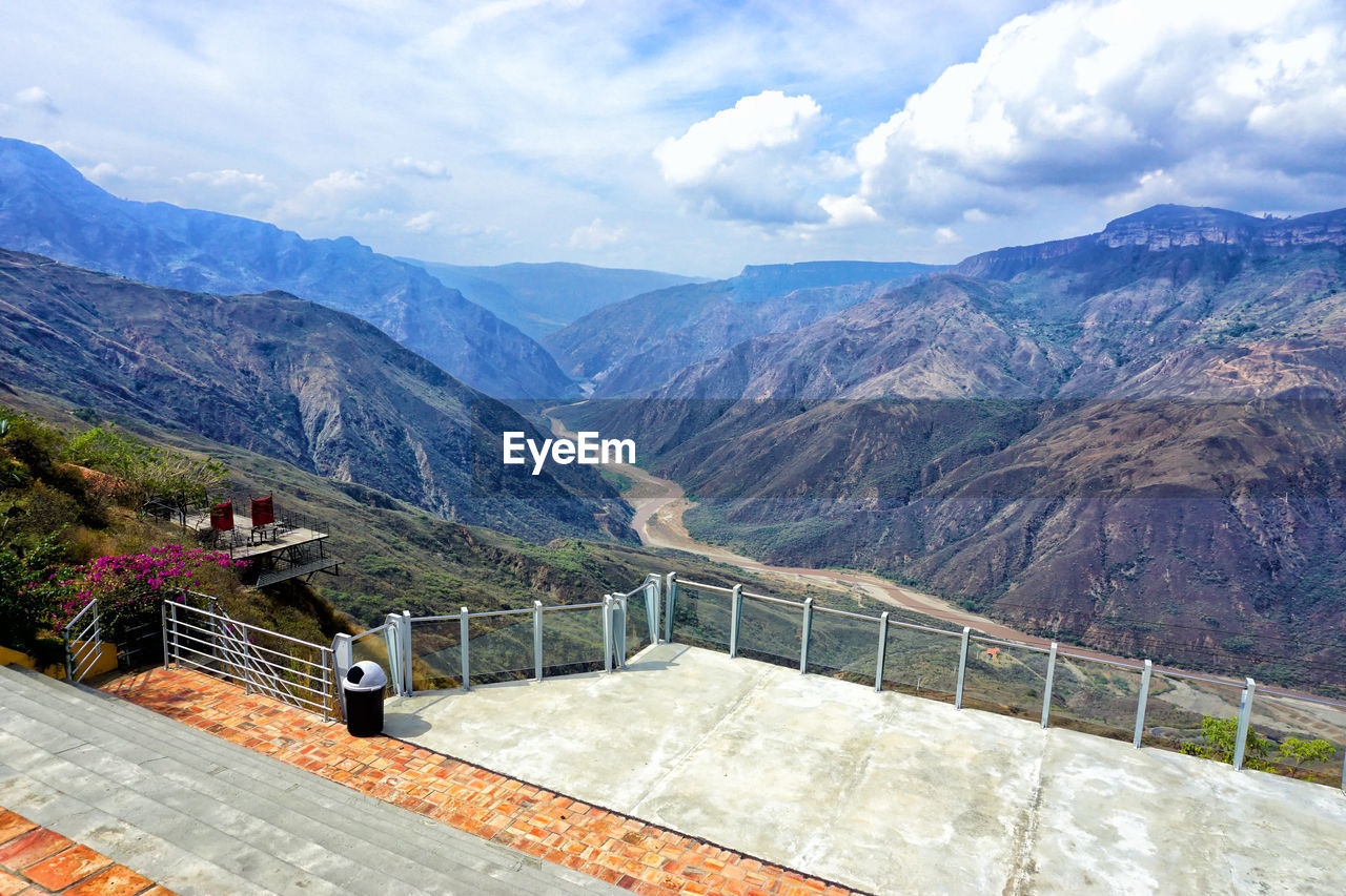 SCENIC VIEW OF DAM AGAINST MOUNTAINS