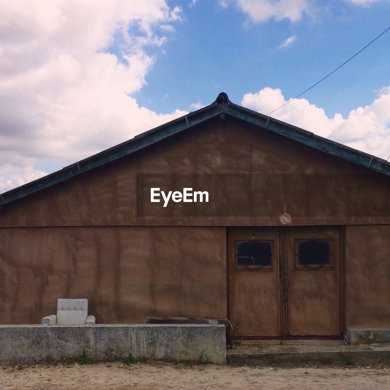 LOW ANGLE VIEW OF BARN IN FACTORY