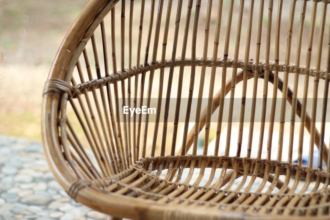 CLOSE-UP OF WICKER BASKET ON BICYCLE WHEEL