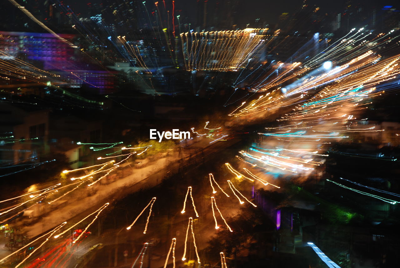 Light trails on road in city at night