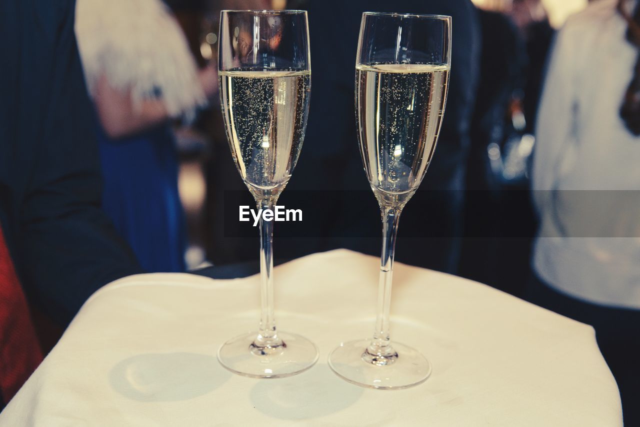 Champagne flutes on tray in restaurant