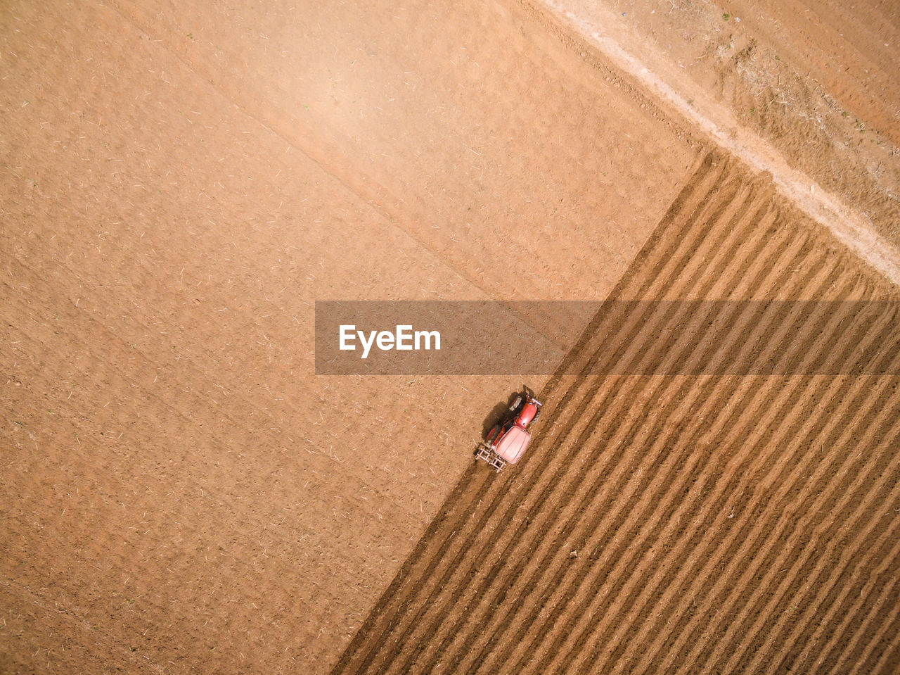 Directly above shot of tractor on field