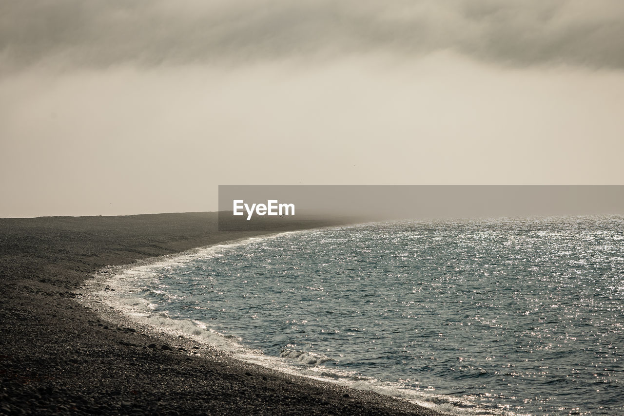 scenic view of sea against cloudy sky