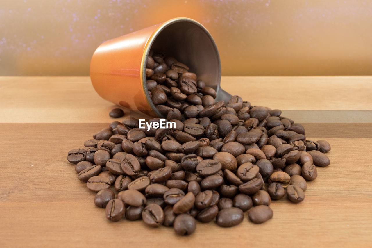 Close-up of coffee beans on table