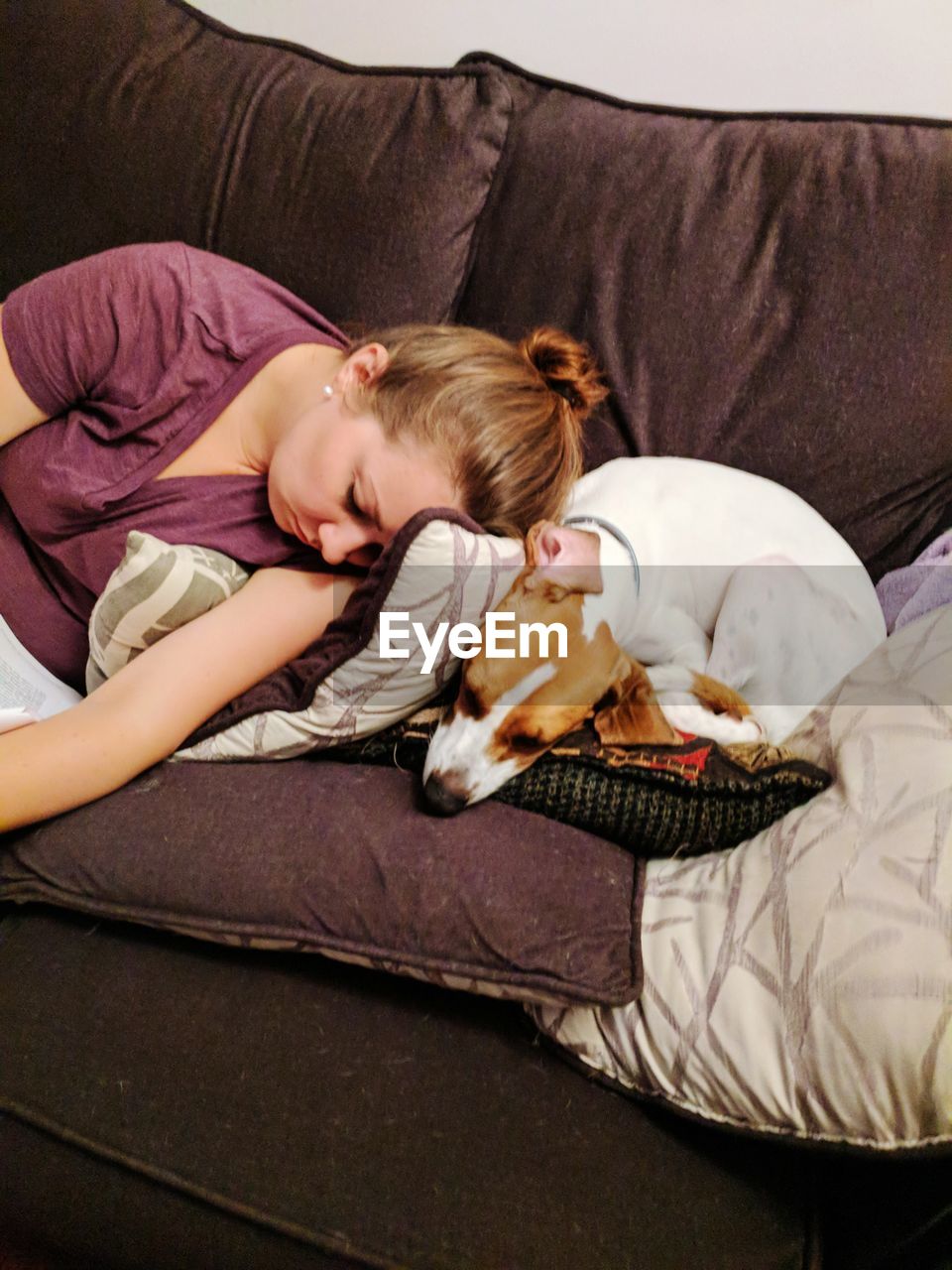 YOUNG WOMAN SLEEPING ON BED