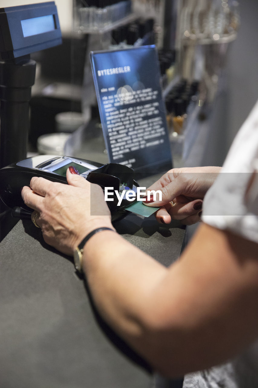 Woman paying with credit card