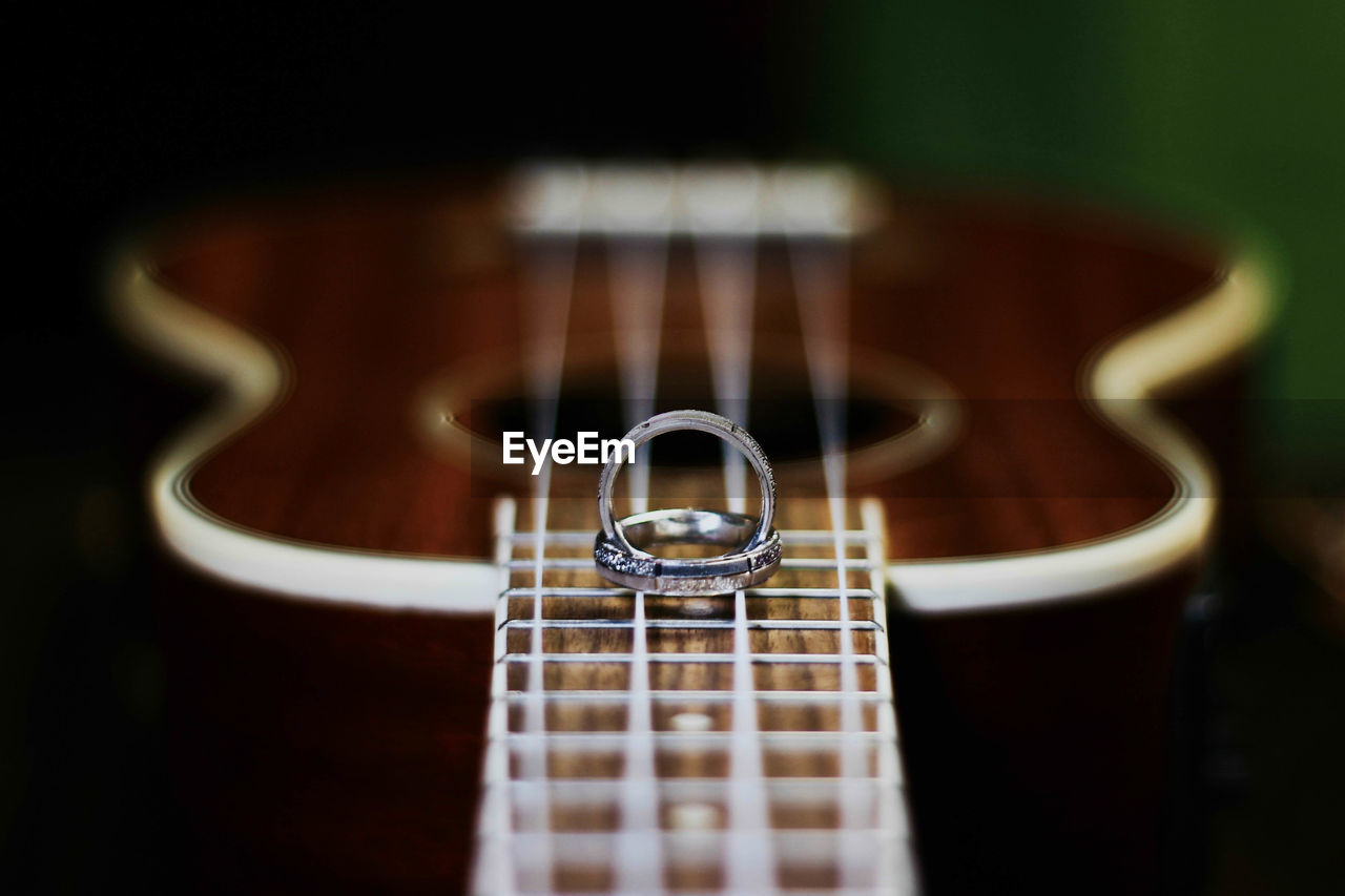 Close-up of rings on guitar