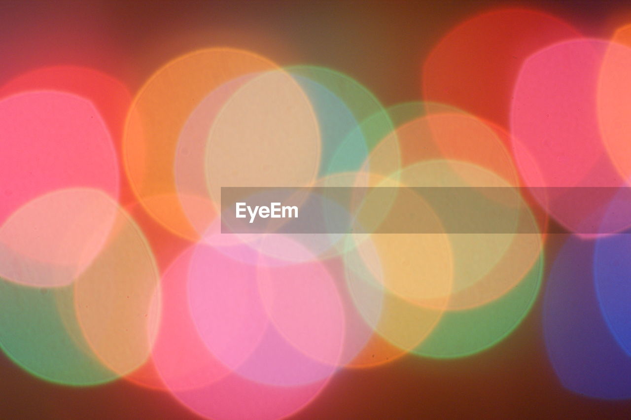 CLOSE-UP OF ILLUMINATED MULTI COLORED LIGHTS