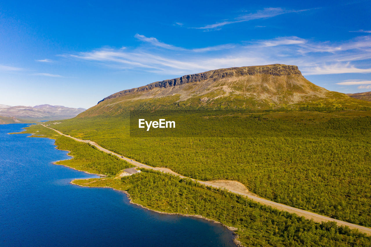 Aerial view of saana mountain, lake, road and forest in kilpisjärvi, finland