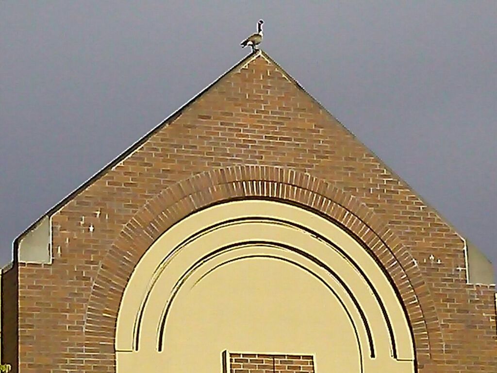 LOW ANGLE VIEW OF BUILT STRUCTURE AGAINST THE SKY