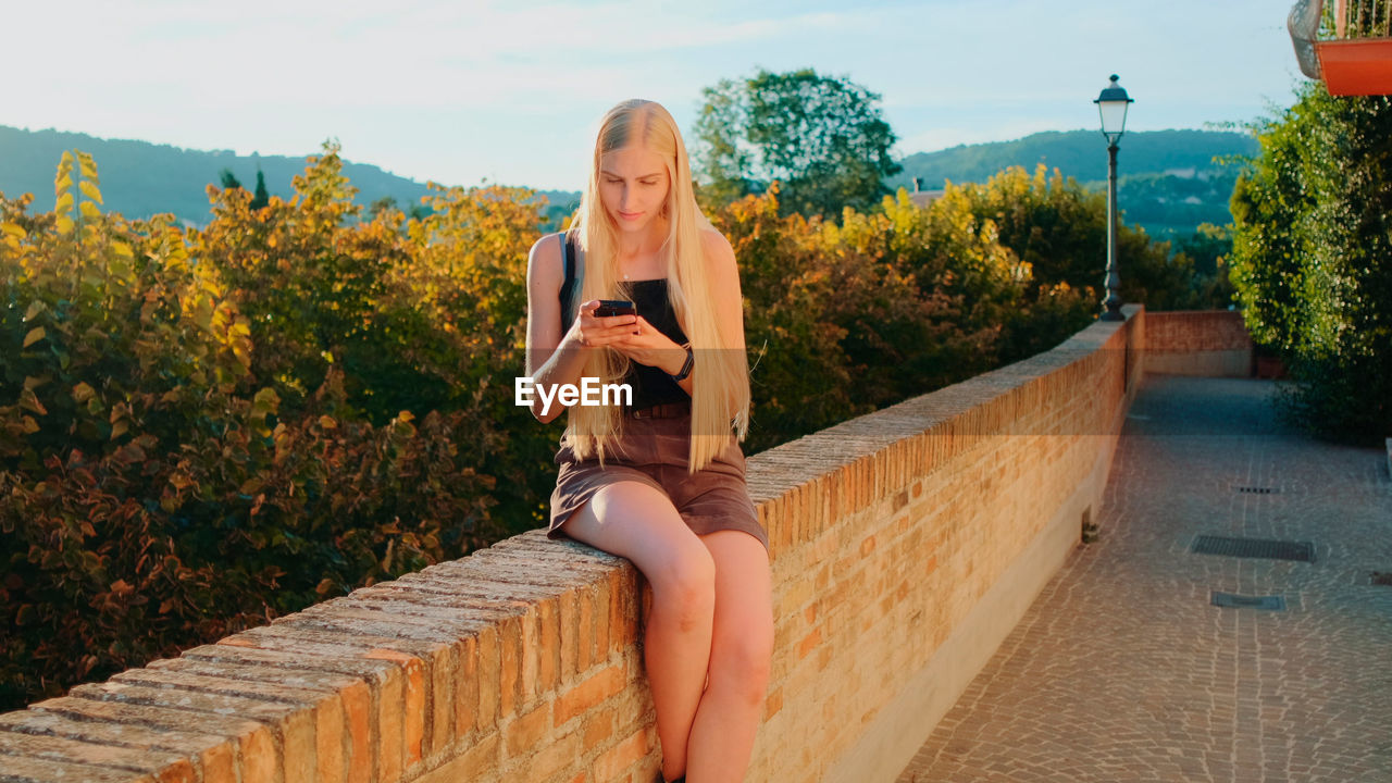 rear view of woman standing on steps