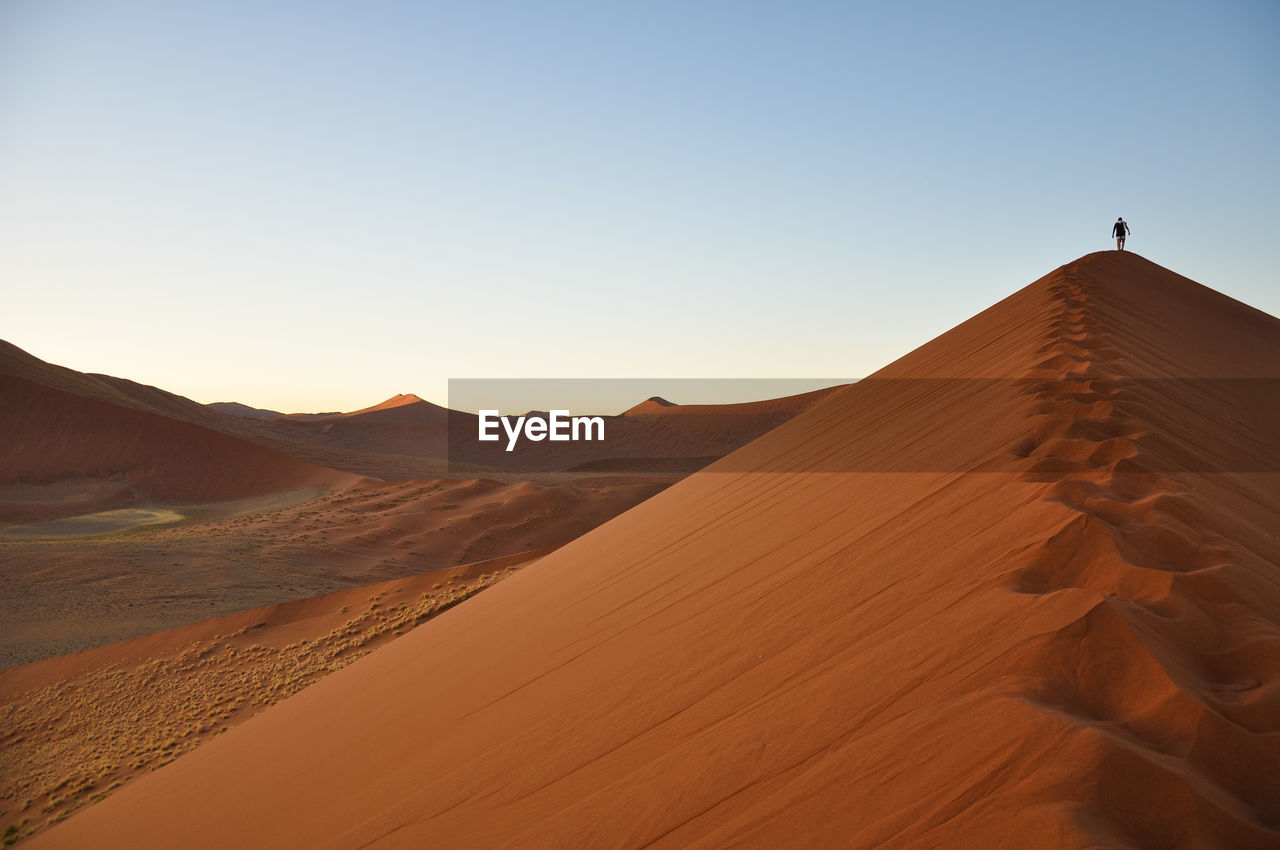 View of desert against clear sky