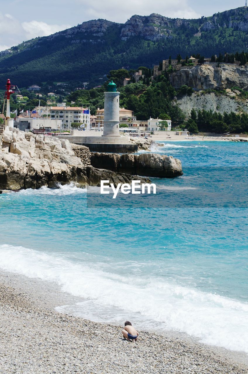 Scenic view of sea against mountains