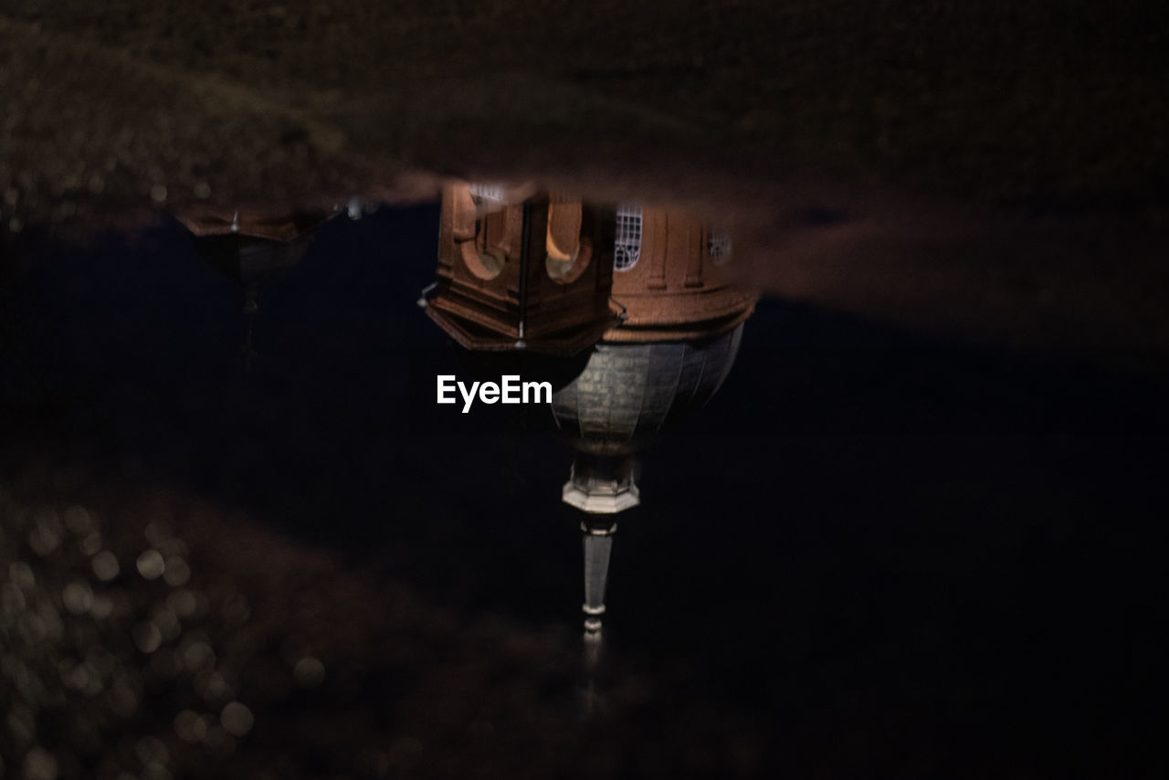 High angle view of light bulbs in water at night