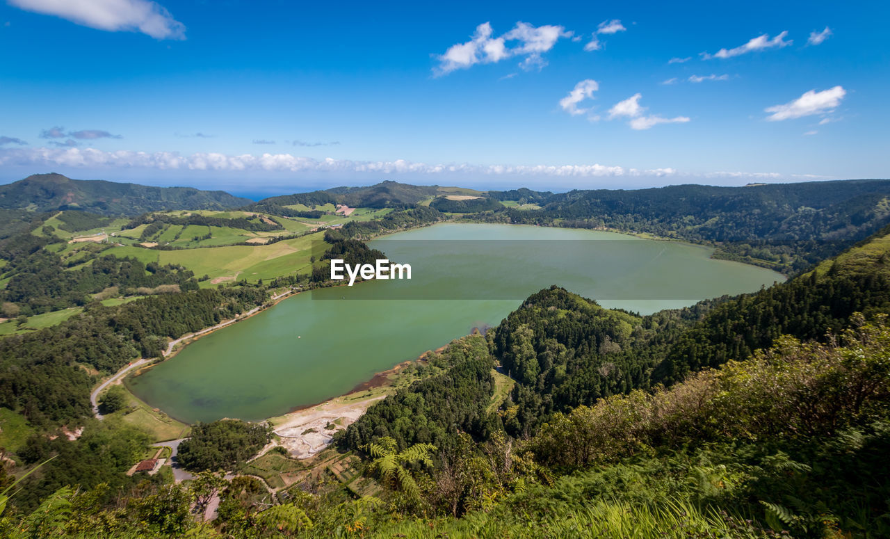 PANORAMIC VIEW OF LANDSCAPE AND LAKE AGAINST SKY