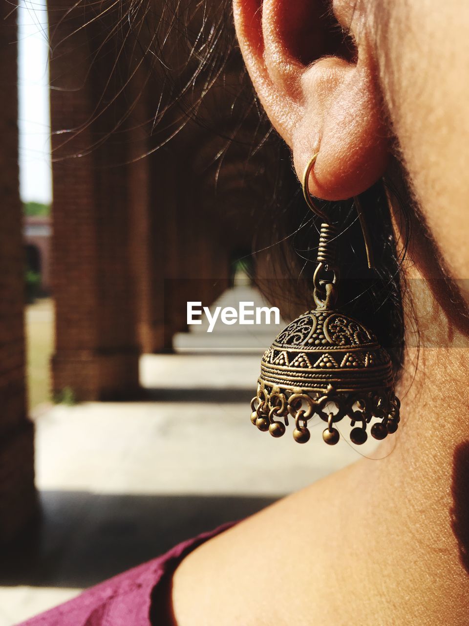 Close-up of woman wearing earring