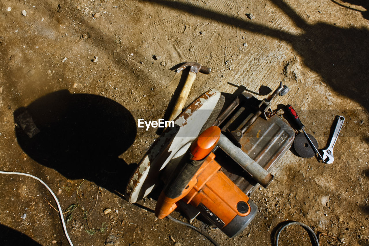 High angle view of work tools on ground