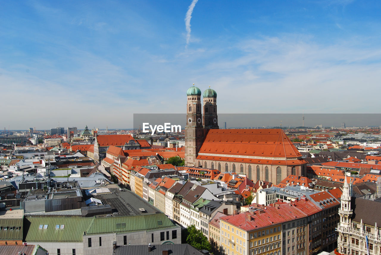 Munich cathedral with cityscape against sky